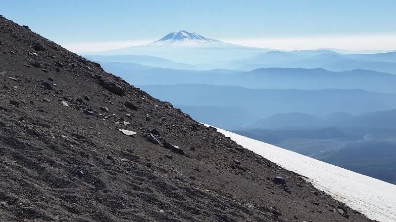 Carew_watches_a_beatiuful_Mt._Adams_in_the_distance_from_the_slopes_of_Mt._St._Helens[1]