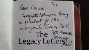 Nancy Pearl signs The Legacy Letters for Award Finalist Carew Papritz